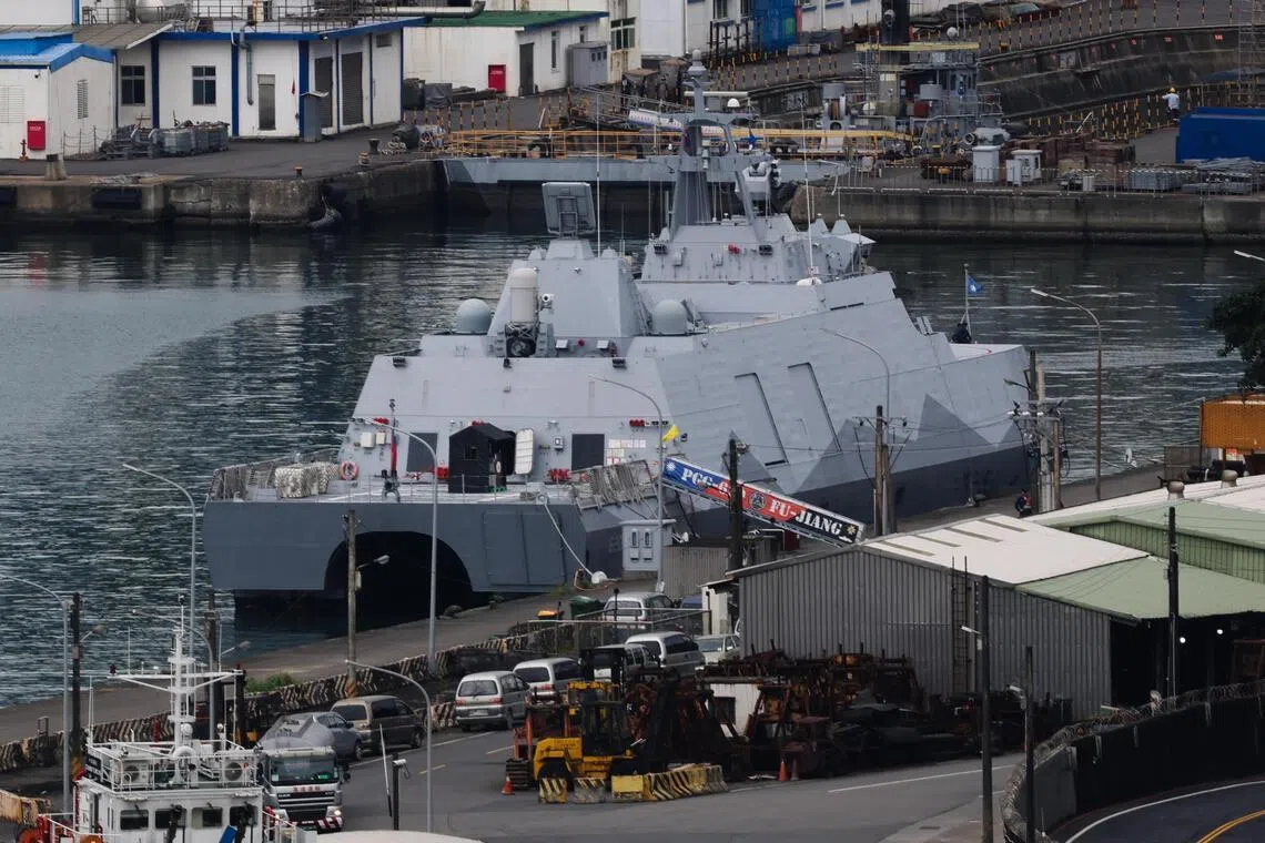 A Tuo Chiang-class corvette is anchored in the port of Keelung city, Taiwan.
