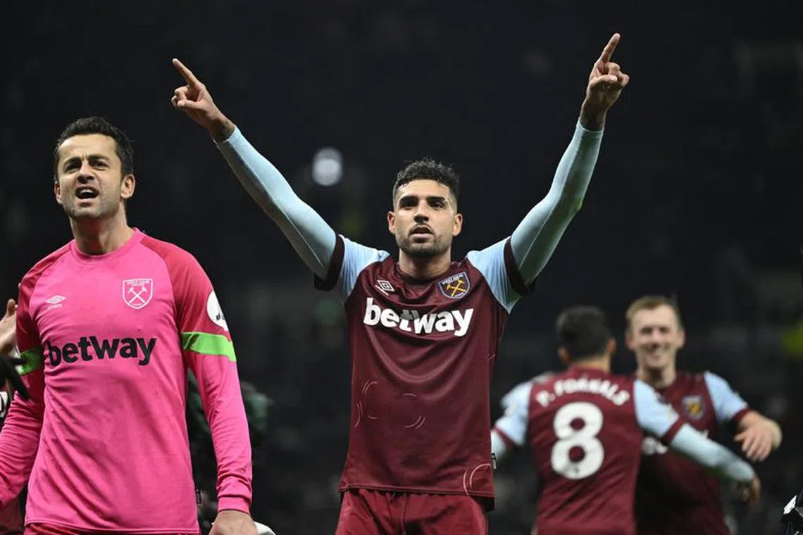 Soccer Football - Premier League - Tottenham Hotspur v West Ham United - Tottenham Hotspur Stadium, London, Britain - December 7, 2023 West Ham United's Lukasz Fabianski and Emerson Palmieri celebrate after the match REUTERS/Tony Obrien