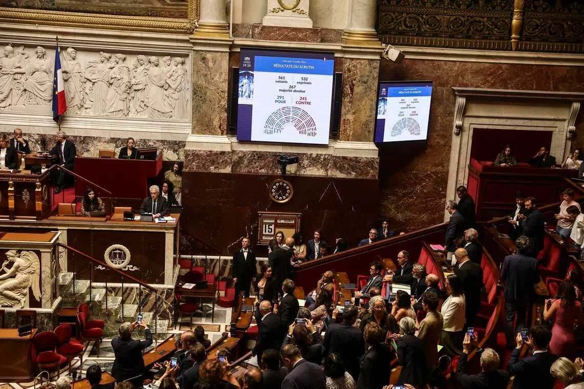 Screens displaying the results of the assisted dying vote on July 15 in France’s Nation Assembly: 291 in favour and 241 against.