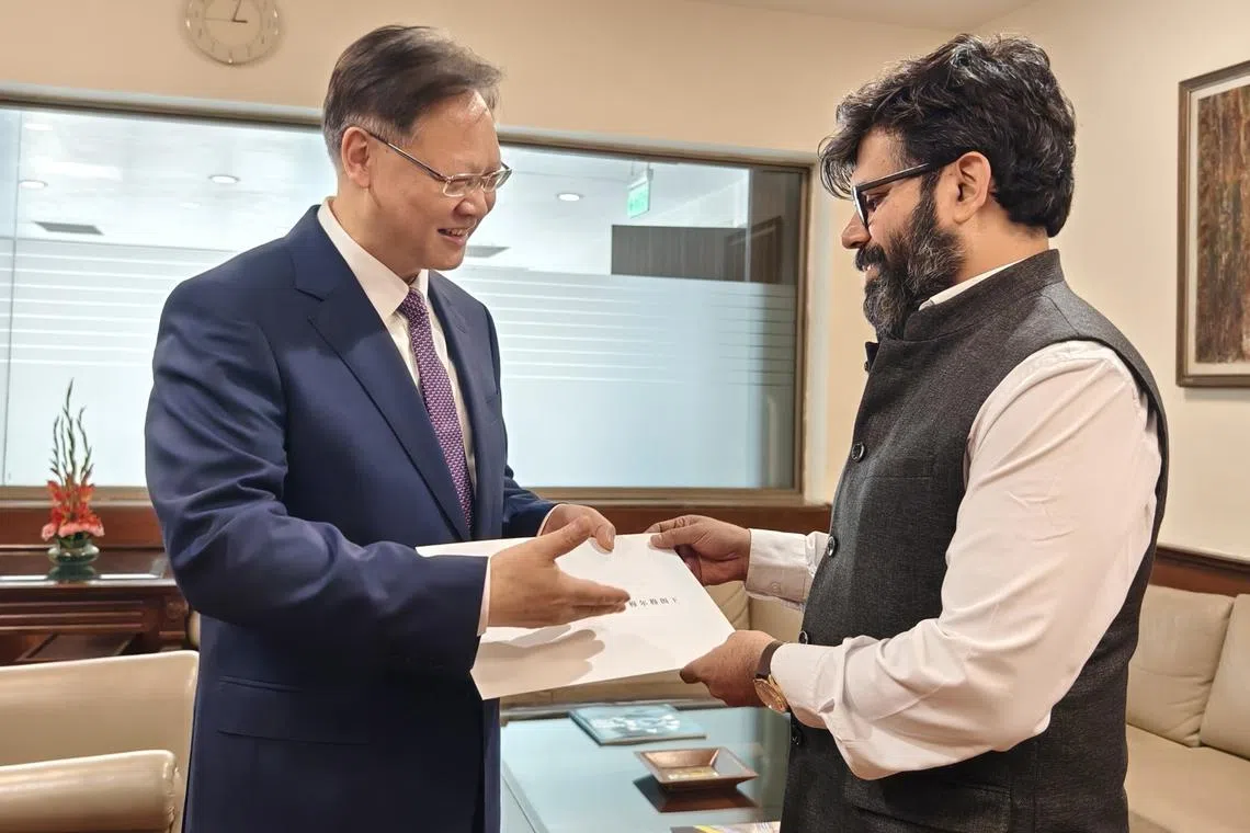 Chinese ambassador to India Xu Feihong presents his credentials to acting Chief of Protocol Rohit Rathish in the Ministry of External Affairs in New Delhi.