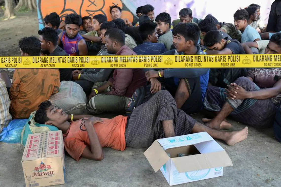 Rohingya Muslim refugees take rest at a skateboard park that is being used as temporary shelter after they were refused shelter by local residents, following their arrival, in Banda Aceh, Indonesia, December 11, 2023. REUTERS/Riska Munawarah