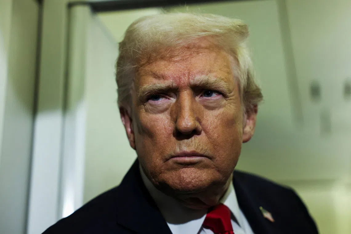 U.S. President Donald Trump looks on aboard Air Force One during travel to Palm Beach, Florida, from Joint Base Andrews, Maryland, U.S., November 25, 2025. REUTERS/Anna Rose Layden