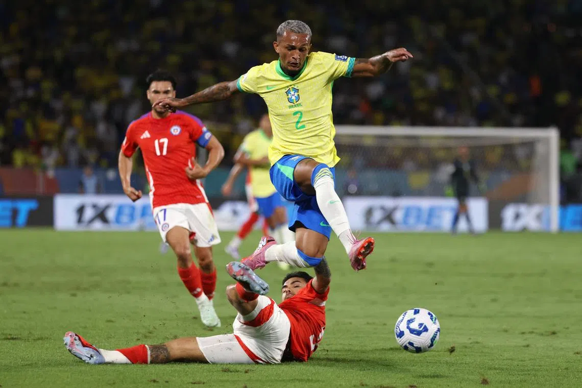 Soccer Football - World Cup - CONMEBOL Qualifiers - Brazil v Chile - Estadio Maracana, Rio de Janeiro, Brazil - September 4, 2025 Brazil's Wesley Franca in action with Chile's Guillermo Maripan REUTERS/Sergio Moraes