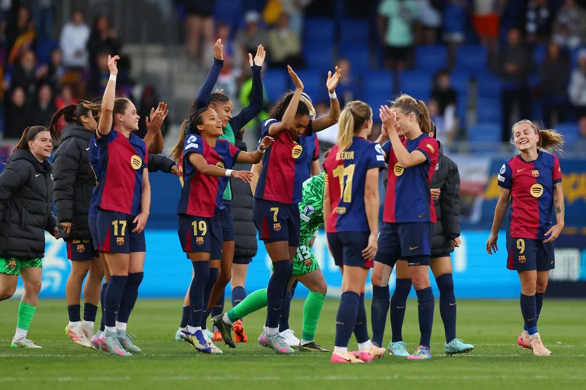 FILE PHOTO: Soccer Football - Women's Champions League - Semi Final - First Leg - FC Barcelona v Chelsea - Estadi Johan Cruyff, Barcelona, Spain - April 20, 2025 FC Barcelona's Vicky Lopez, Salma Paralluelo, Claudia Pina and Ewa Pajor celebrate after the match REUTERS/Albert Gea/File Photo