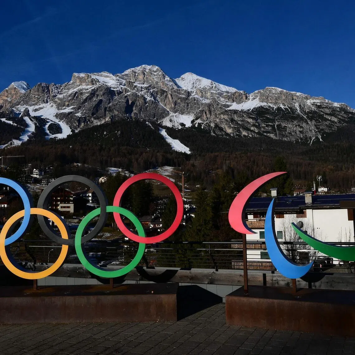 A picture shows the logo of Milano Cortina 2026 Olympic and Paralympic Games with the Women's Alpine skiing Olympia delle Tofane slope in the background, in Cortina d'Ampezzo, on Dec 12, 2025. 