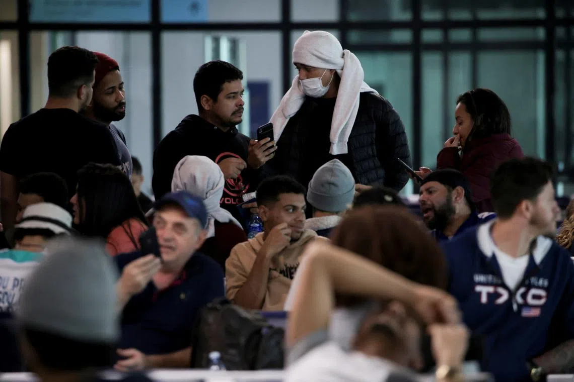 Brazilian migrants deported from the U.S. under President Donald Trump's administration, wait to board a Brazilian Air Force flight to Belo Horizonte at the Eduardo Gomes International Airport in Manaus, Brazil, January 25, 2025. REUTERS/Bruno Kelly