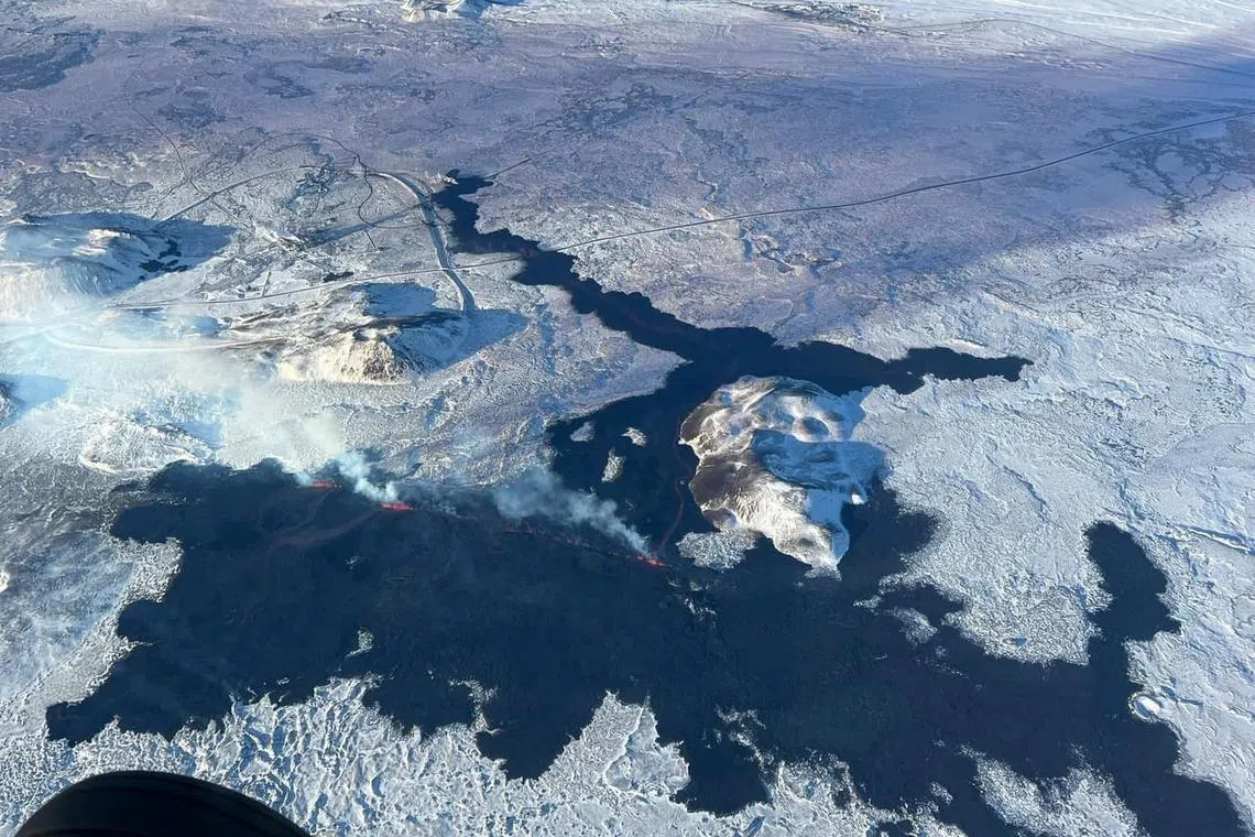 An arial view of the volcano spewing lava and smoke as it erupts, near Grindavik, on Reykjanes Peninsula, Iceland, February 8, 2024. Iceland Civil Protection/Handout via REUTERS THIS IMAGE HAS BEEN SUPPLIED BY A THIRD PARTY. MANDATORY CREDIT. NO RESALES. NO ARCHIVES.