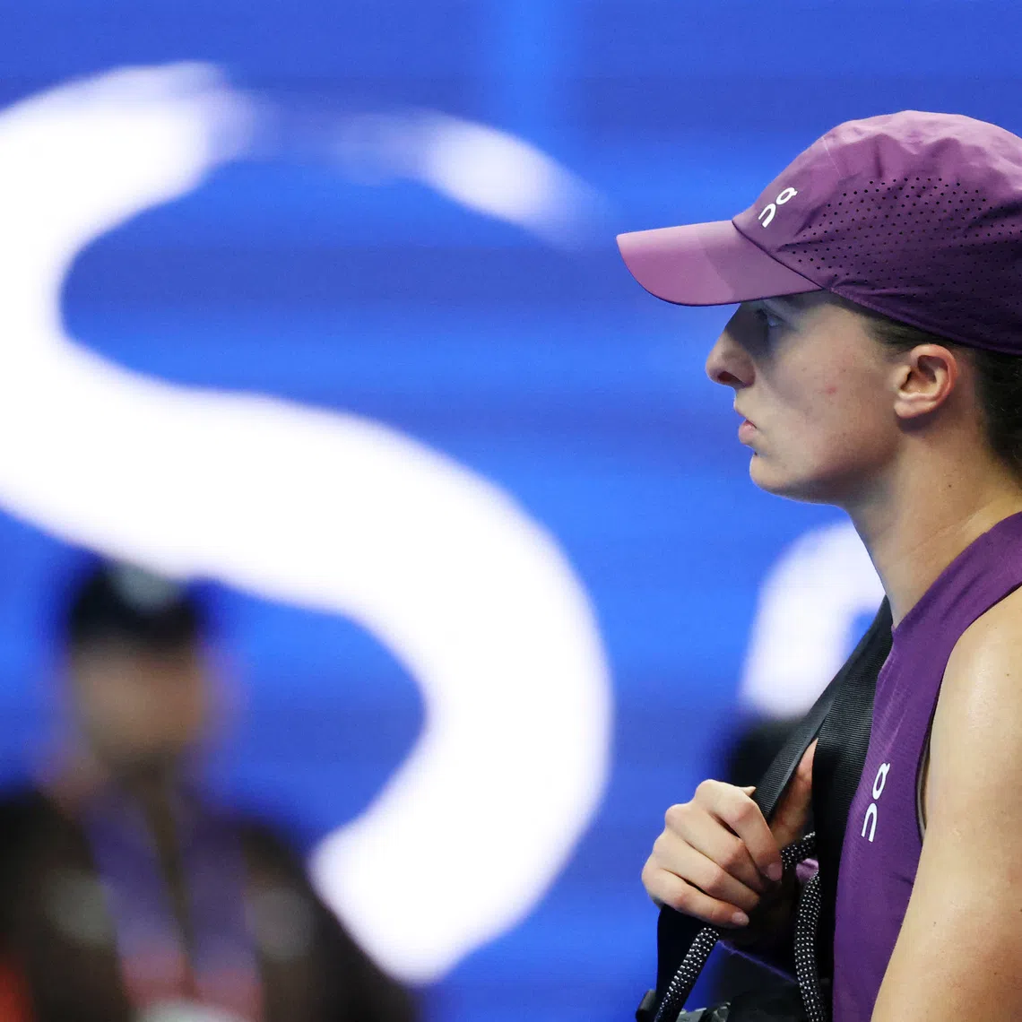 Tennis - China Open - National Tennis Center, Beijing, China - October 9, 2026 Poland's Iga Swiatek looks dejected after losing her quarter final match against Belgium's Elise Mertens REUTERS/Maxim Shemetov