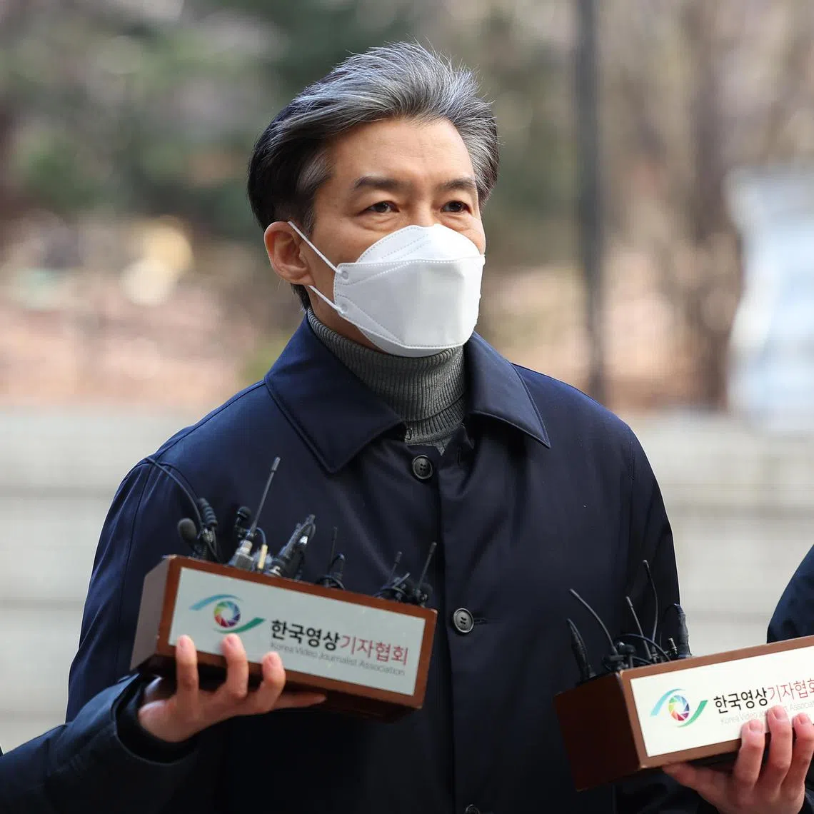 Former Justice Minister Cho Kuk (centre) arrives at the Seoul Central District Court in South Korea on Feb 3, 2023.