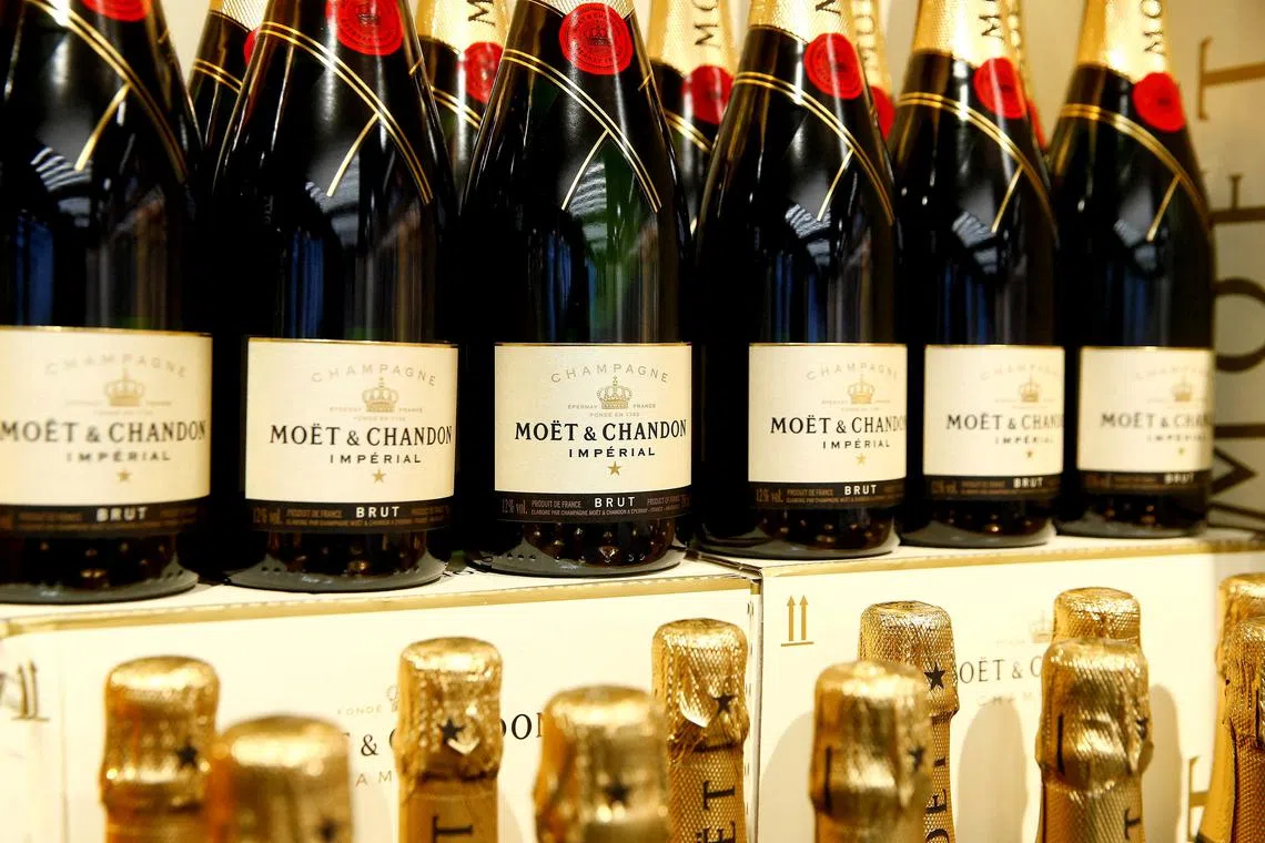 FILE PHOTO: Bottles of French Moet & Chandon champagne are offered at a supermarket of Swiss retail group Coop in Zumikon, Switzerland December 13, 2016.  REUTERS/Arnd Wiegmann