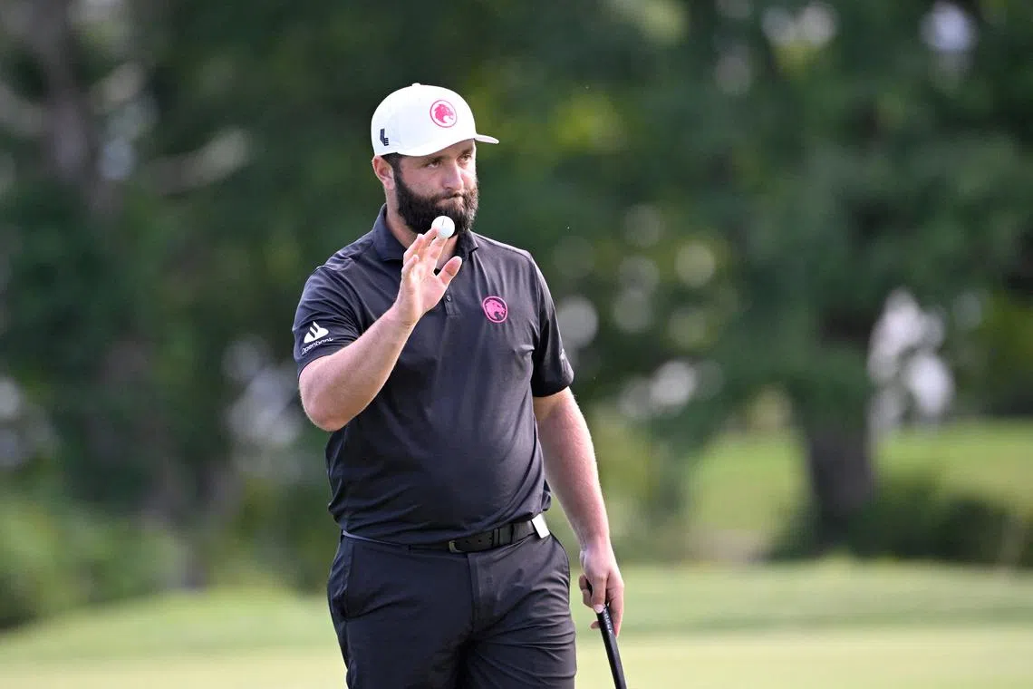 FILE PHOTO: Aug 18, 2024; Greenbrier, West Virginia, USA; Jon Rahm reacts after making a birdie on the 17th hole at The Old White at the Greenbrier. Mandatory Credit: Bob Donnan-USA TODAY Sports/File Photo