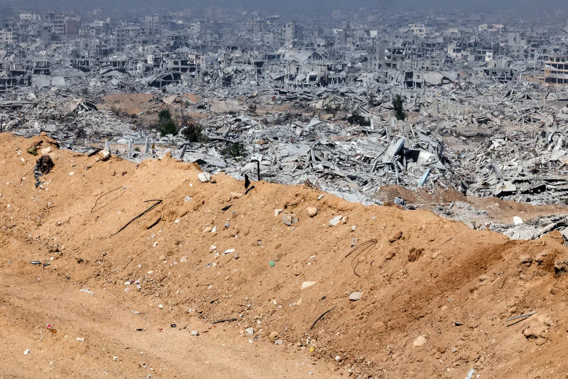 FILE PHOTO: Destroyed buildings as seen from an Israeli military outpost within the borders of the 'yellow line' in the Shujaiya neighborhood in the eastern part of Gaza City in the Gaza Strip November 5, 2025. REUTERS/Nir Elias