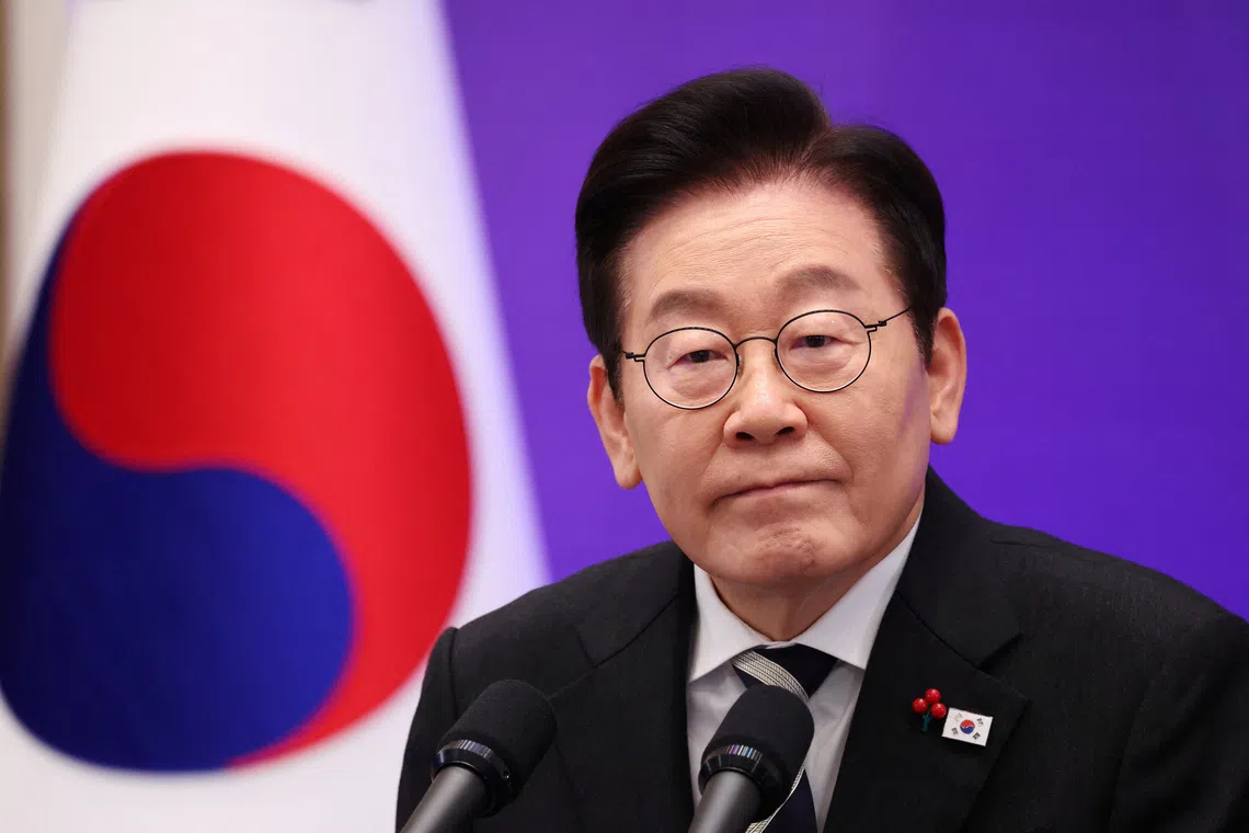 South Korean President Lee Jae Myung listens to a reporter’s question during a press conference to mark the first anniversary of the December 3, 2024, martial law declaration by former President Yoon Suk Yeol, at the Blue House in Seoul, South Korea, December 3, 2025. REUTERS/Kim Hong-Ji