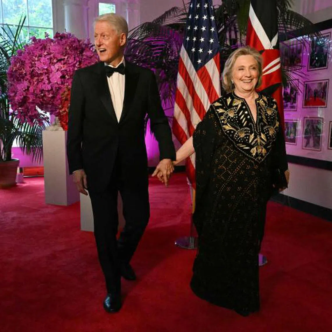 Ex-US president Bill Clinton and his wife Hillary arrive at the White House for a state dinner on May 23, 2024. 