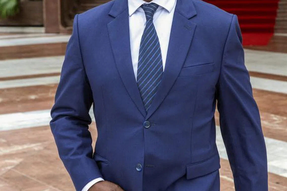 Raymond Ndong Sima, a former opposition leader, walks after being appointed as prime minister of its transitional government by Gabon's ruling junta, which seized power in a coup, at the presidential palace in Libreville, Gabon September 7, 2023. REUTERS/Stringer