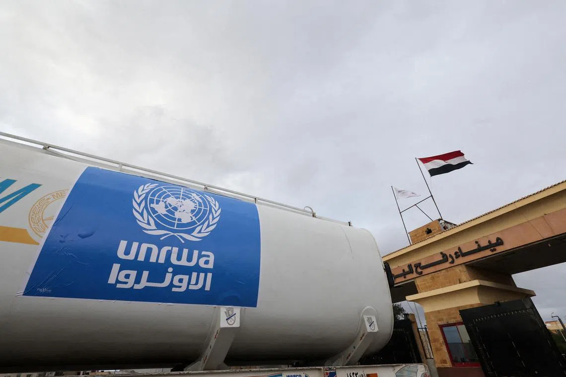 A truck, marked with United Nations Relief and Works Agency (UNRWA) logo, crosses into Egypt from Gaza. Photo