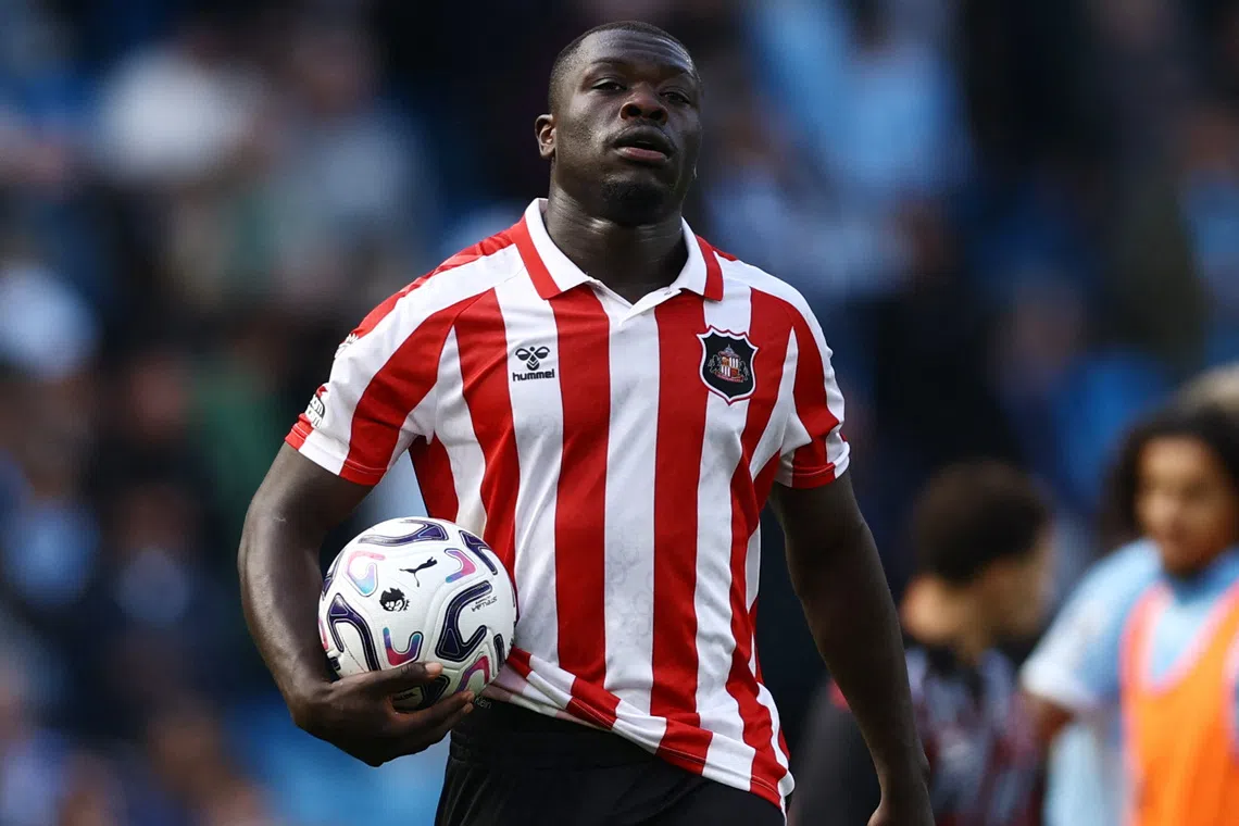 Sunderland’s Brian Brobbey carries the match ball at the end of the match after completing a hat-trick.