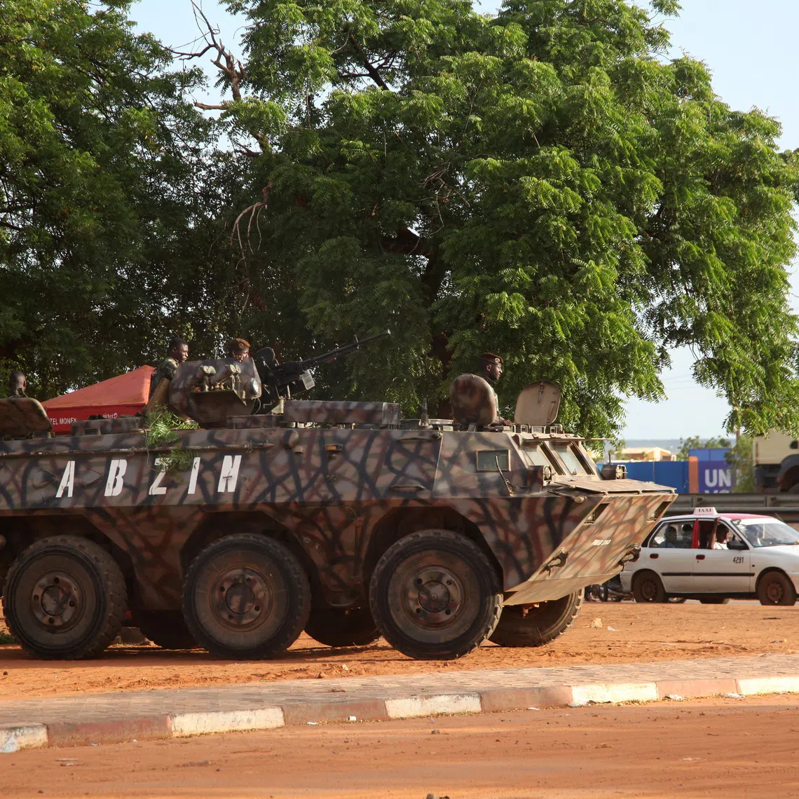 A military armoured vehicle takes position on the street following a mutineers' attack on the airport and the presidency in Niamey, Niger, August 30, 2026. REUTERS/Stringer
