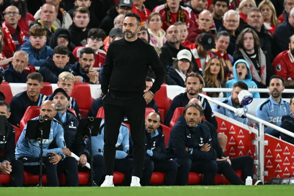 Tottenham Hotspur’s Italian head coach Roberto De Zerbi watches the players from the touchline as they played against Liverpool during the English League Cup third round match.