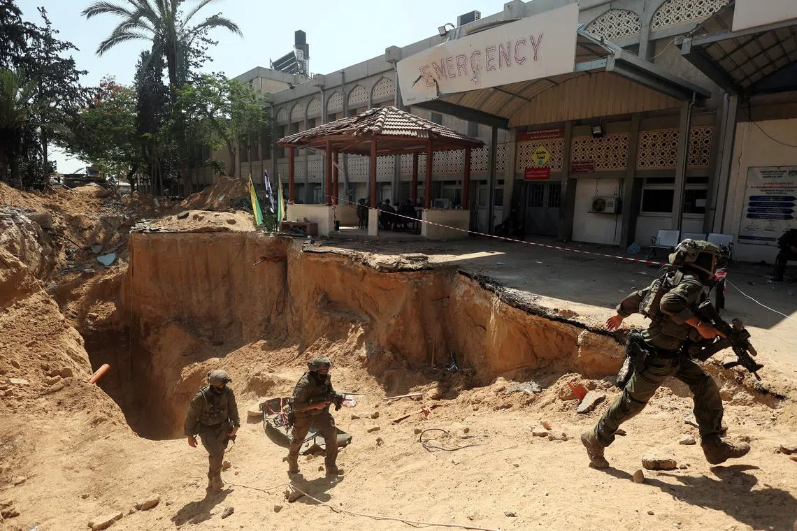 Israeli soldiers walk out from a tunnel underneath the European Hospital in Khan Younis at the Gaza Strip, amid the ongoing ground operation of the Israeli army against Palestinian Islamist group Hamas, June 8, 2025. REUTERS/Ronen Zvulun