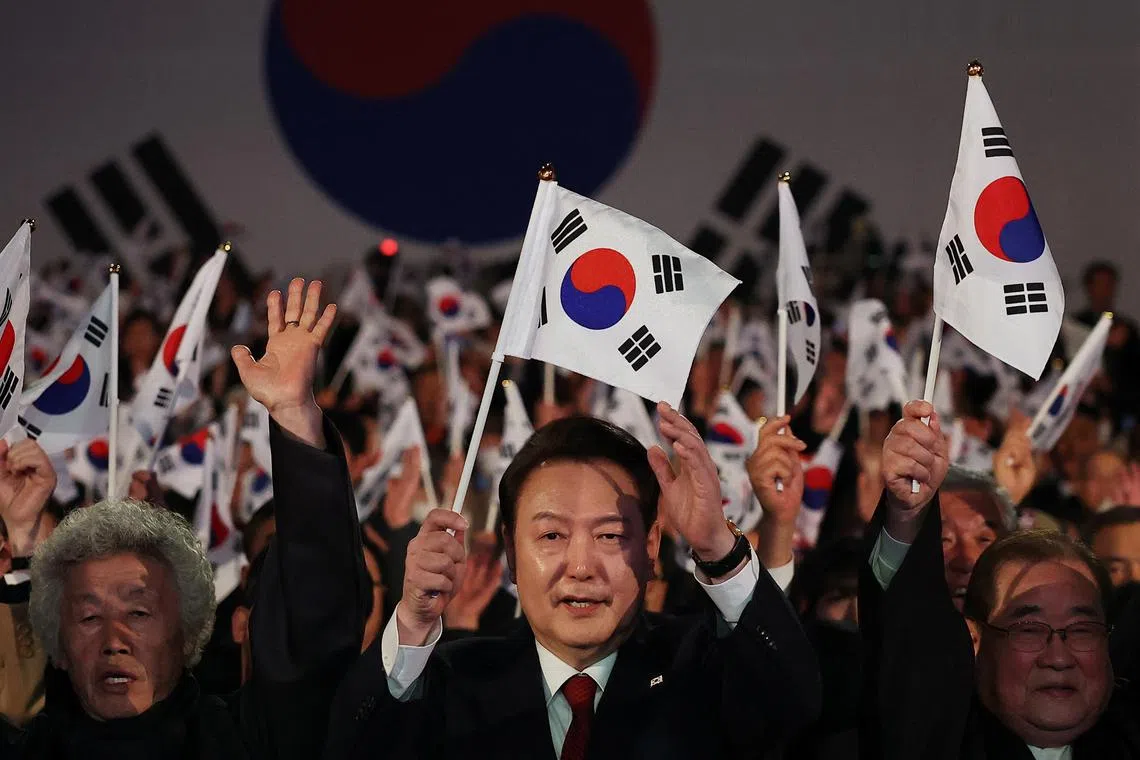 South Korea's President Yoon Suk Yeol gives three cheers during a ceremony of the 105th anniversary of the March 1st Independence Movement Day in Seoul, South Korea, March 1, 2024.    REUTERS/Kim Hong-Ji/Pool