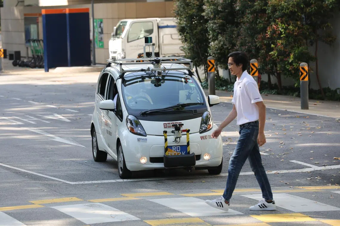 A self-driving electric vehicle being tested on the road in University Town at the National University of Singapore.