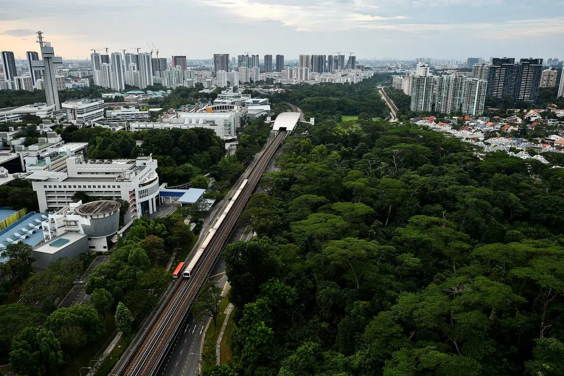 Dover Forest (bottom right), Dover MRT station (middle), Singapore Polytechnic (left) and HDB flats in Clementi (top left) as viewed from Ghim Moh Link on January 17, 2021.