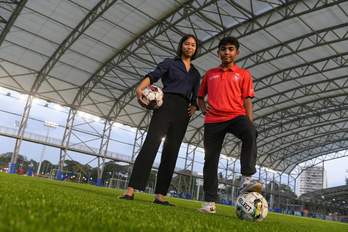 Charis Han En, 17, and Putera Nur Muhammad Irfan Ismail, 14, at the Kallang Football Hub on July 29. They are among nine second-batch recipients of the Unleash The Roar! project overseas scholarship.