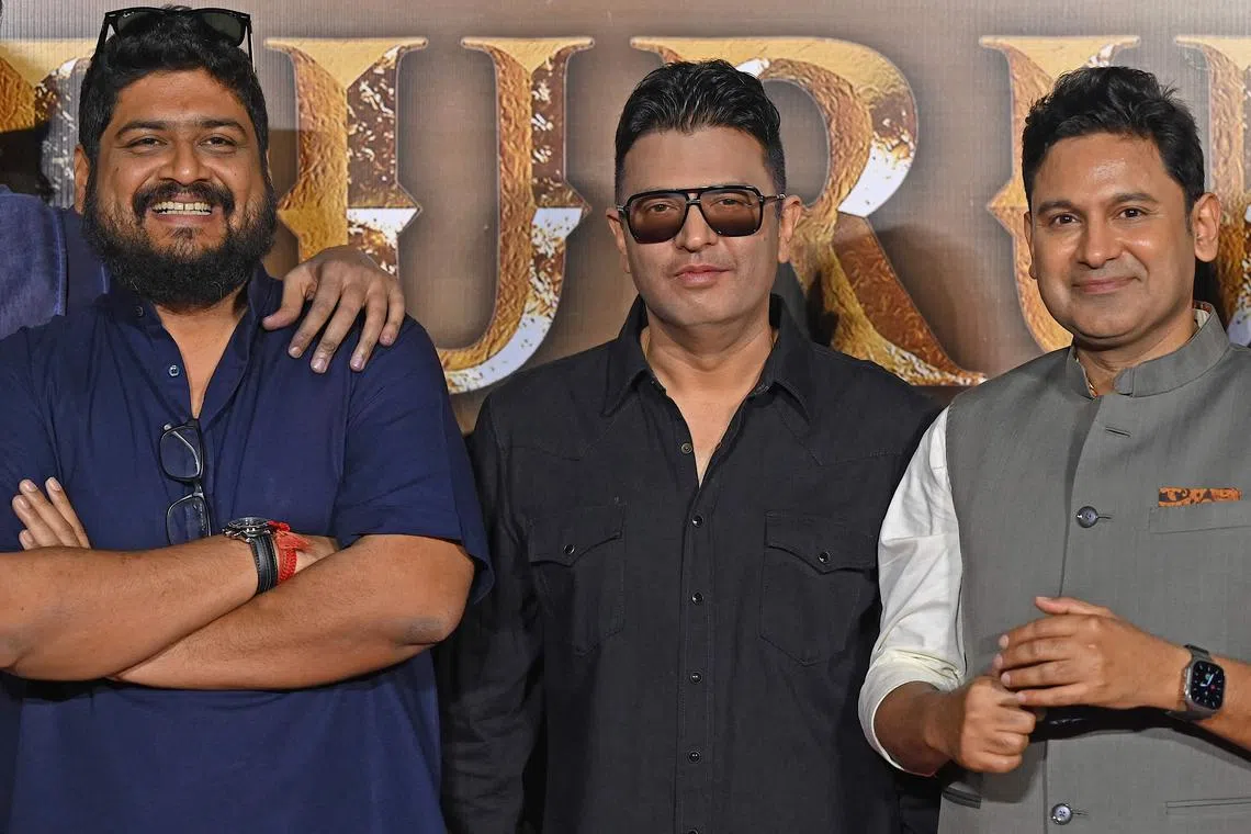 Indian film writer and director Om Raut (L), producer Bhushan Kumar (C) and poet, screenwriter Manoj Muntashir Shukla attend the trailer launch of their mythological movie Adipurush in Mumbai on May 9, 2023. 