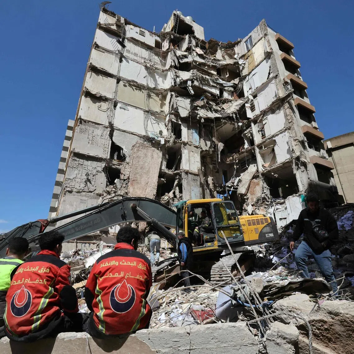 Lebanese rescuers clear the rubble at the site of an Israeli airstrike that targeted a building the day before in Beirut on April 9, 2026. 