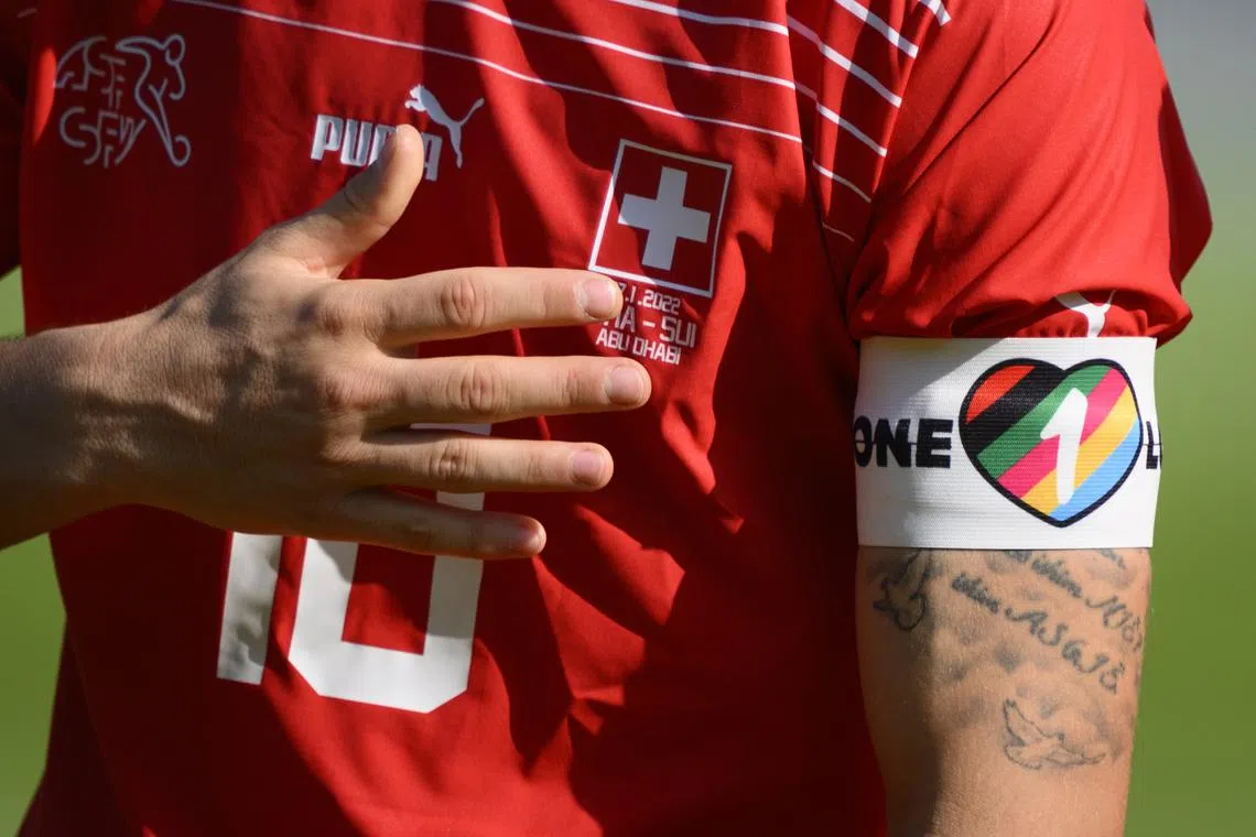 Close up of Switzerland's midfielder Granit Xhaka with the "One Love" captain's armband as he sings the national anthem during a friendly football match between Switzerland and Ghana in preparation for the Fifa World Cup Qatar 2022, at the Sheikh Zayed Sports City Stadium, in Abu Dhabi, United Arab Emirates last Thursday.