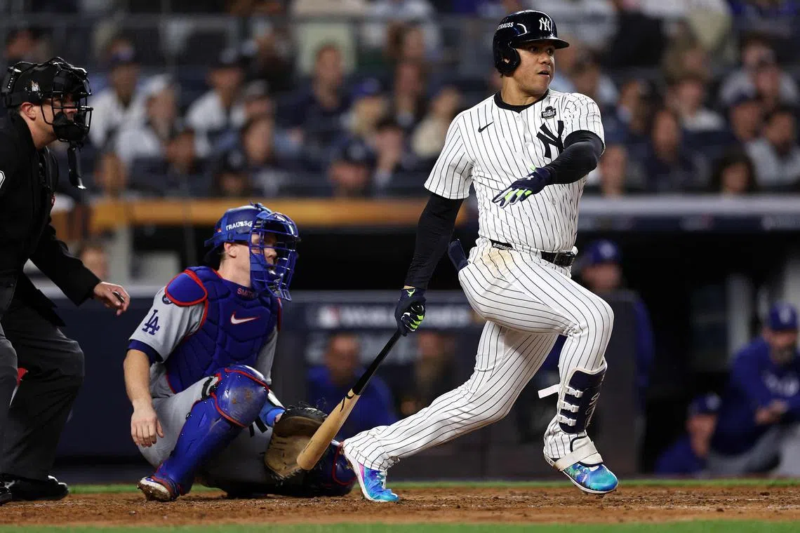 Juan Soto of the New York Yankees hitting a single during the fourth inning of Game Five of the 2024 World Series against the Los Angeles Dodgers at Yankee Stadium on Oct 30.