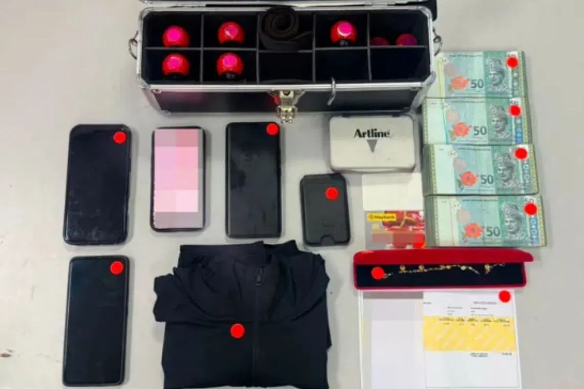 3 arrested in Malaysian checkpoint for creating fake immigration movement records