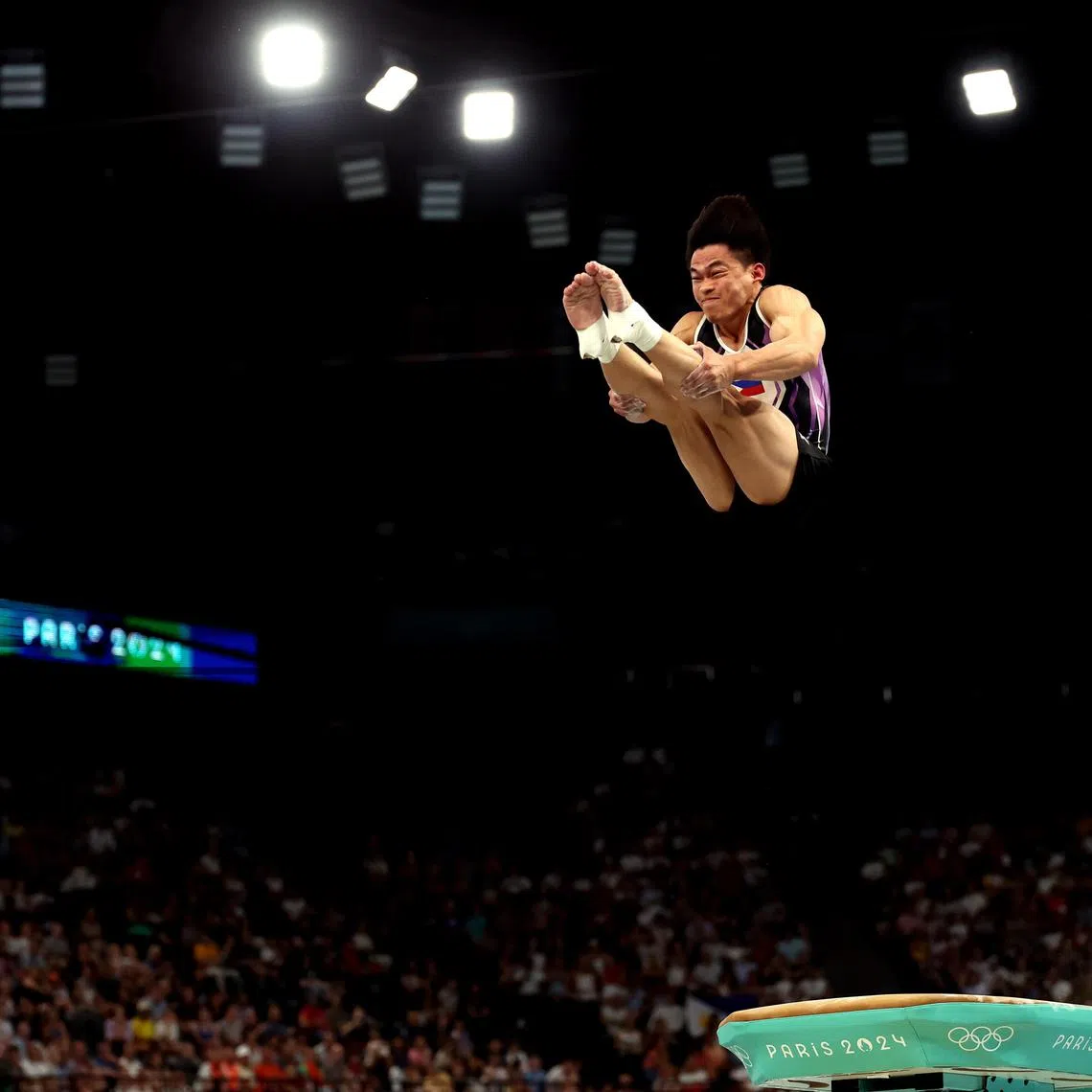epa11525301 Carlos Edriel Yulo of Philippines performs during the Men's Vault Final of the Artistic Gymnastics competitions in the Paris 2024 Olympic Games, at the Bercy Arena in Paris, France, 04 August 2024.  EPA-EFE/MOHAMMED BADRA