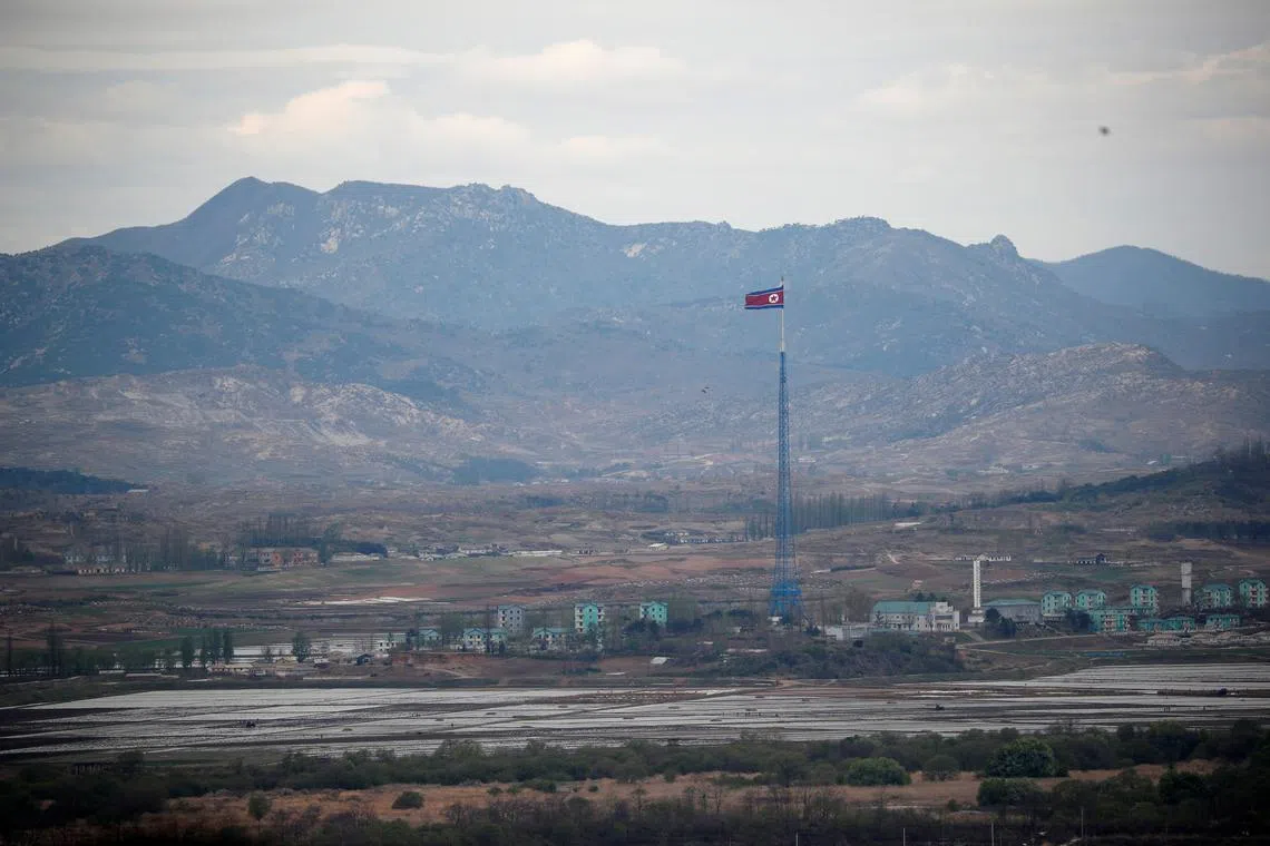 FILE PHOTO: A North Korean flag flutters on top of a 160-metre tower in North Korea's propaganda village of Gijungdong, in this picture taken from the Dora observatory near the demilitarised zone separating the two Koreas, in Paju, South Korea, April 24, 2018. REUTERS/Kim Hong-Ji/File Photo