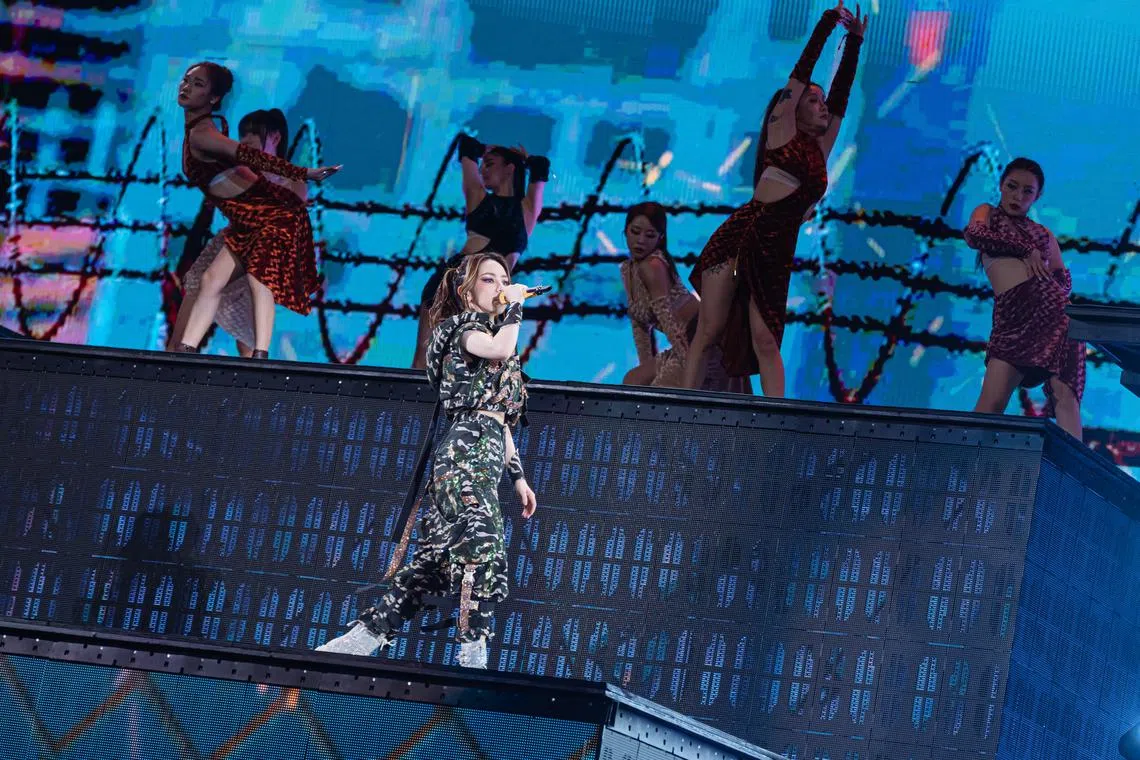 Hong Kong singer G.E.M. performing the angsty rap number Miss Similar during her concert at the National Stadium on March 1.