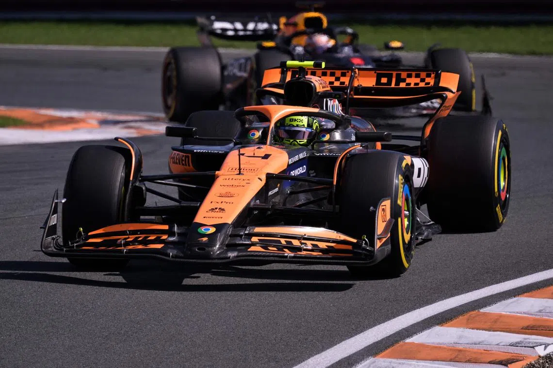 McLaren's British driver Lando Norris ahead of Dutch driver Max Verstappen of the Red Bull during the Formula One Dutch Grand Prix on Aug 25.