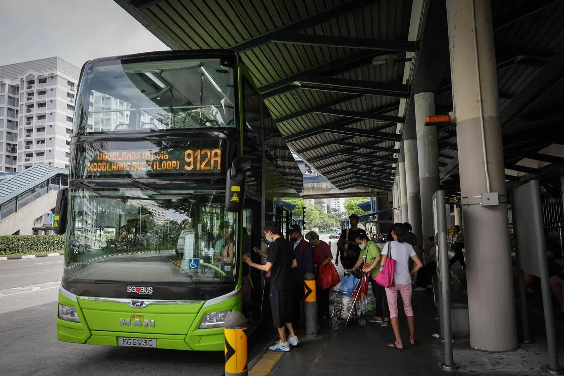 Generic photo of people waiting at a bus stop in Chinatown on Jan 19, 2024.