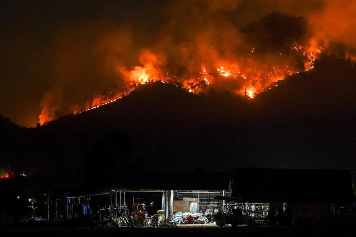 A mountain in the Khao Laem National Park in Nakhon Nayok was engulfed in flames on Wednesday night.