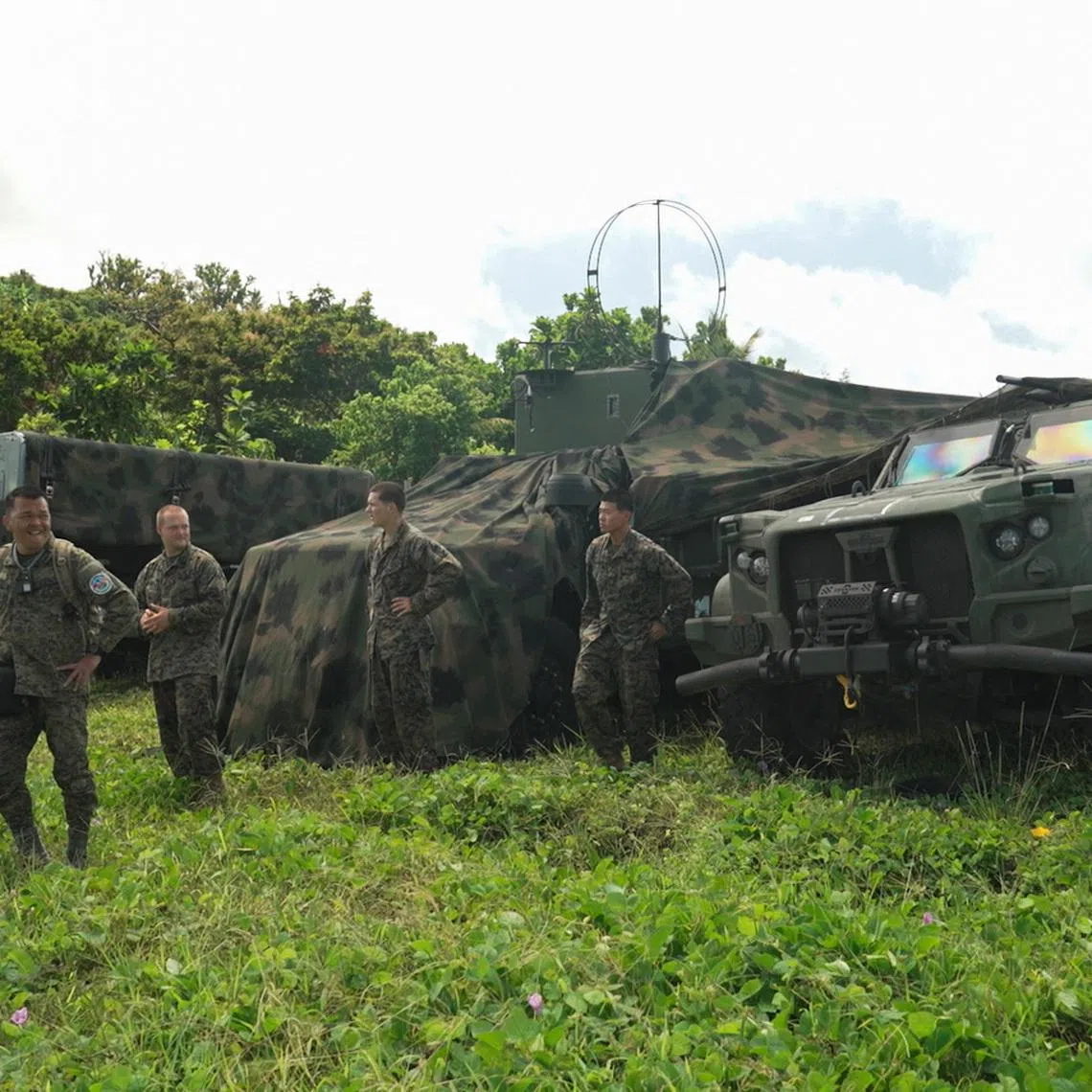 Philippine and U.S. military personnel stand beside vehicles and equipment used for the Navy-Marine Expeditionary Ship Interdiction System (NMESIS) anti-ship missile system during joint military exercises in Basco, Batanes province, Philippines, May 2, 2026. REUTERS/Adrian Portugal