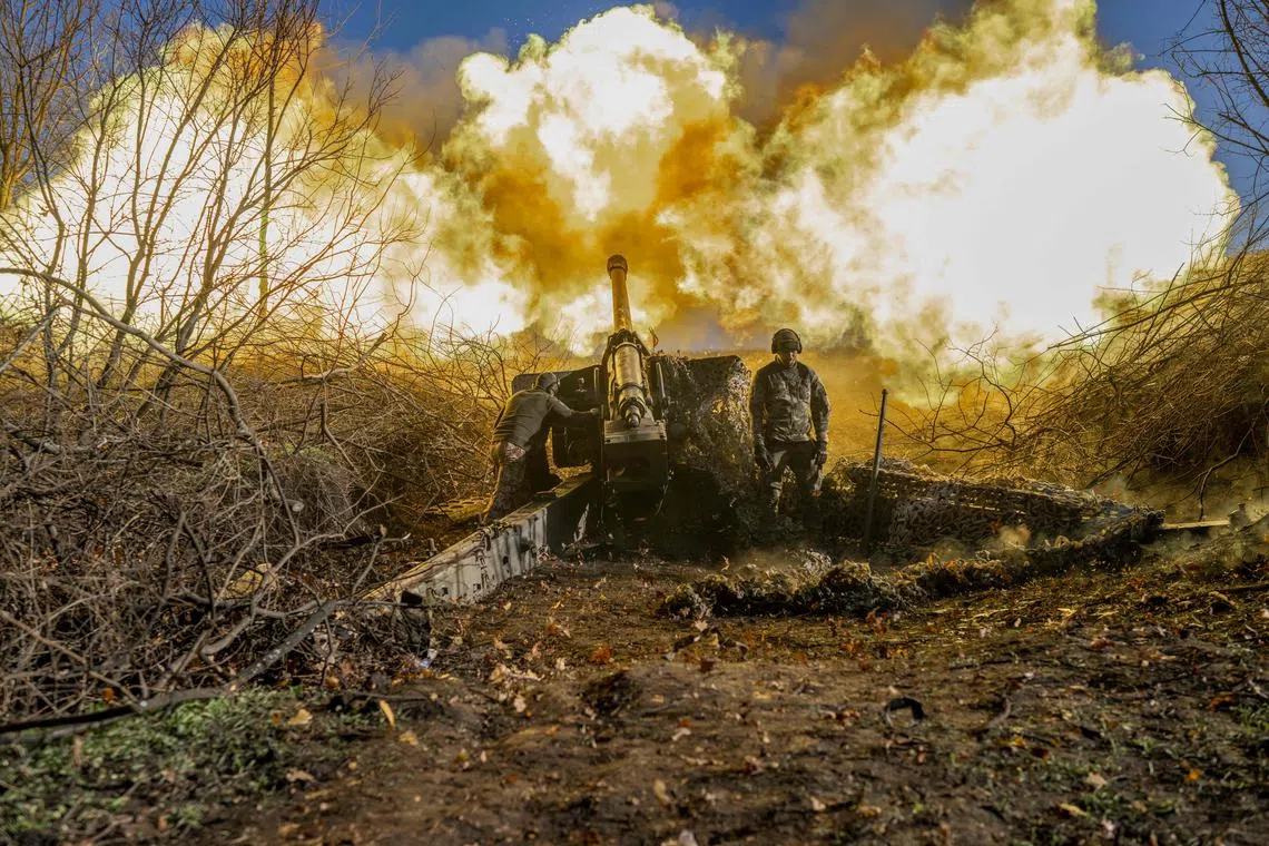 A Ukrainian soldier of an artillery unit fires towards Russian positions outside Bakhmut on Nov 8, amid the Russian invasion of Ukraine. 