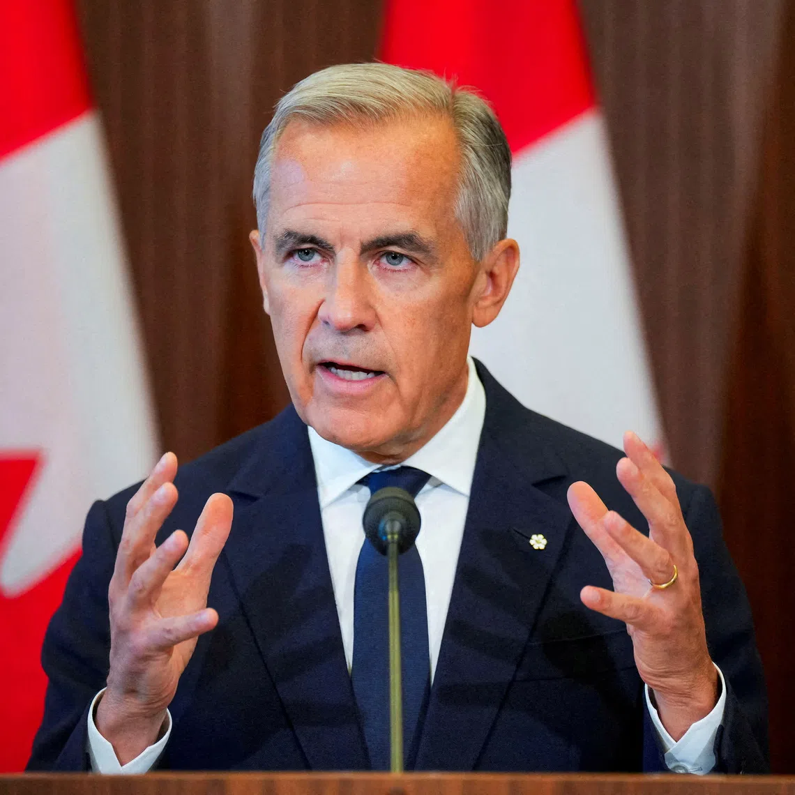 Canadian Prime Minister Mark Carney speaking to the media on Aug 22, after suspending trade negotiations with the US.