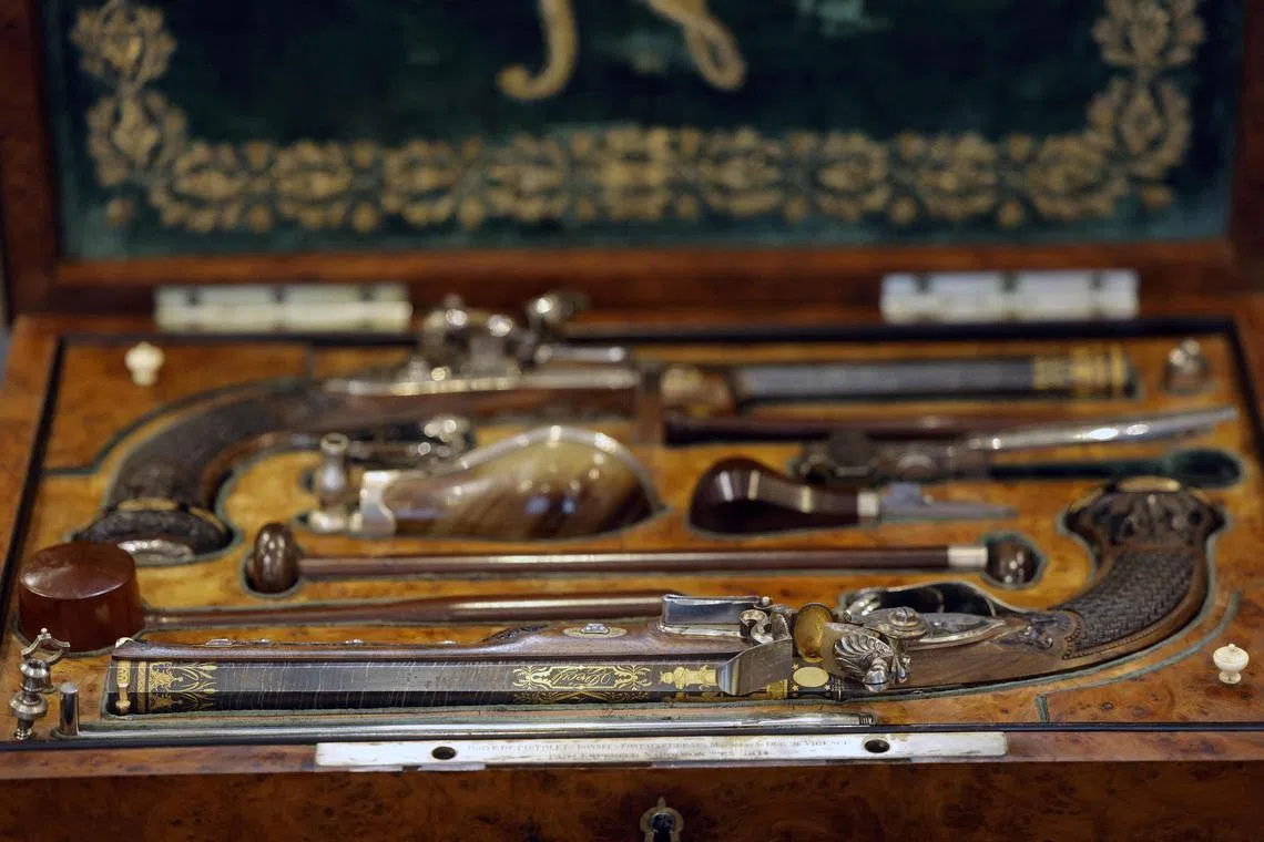 The richly decorated guns inlaid with gold and silver feature the engraved image of Napoleon in full imperial pomp. 