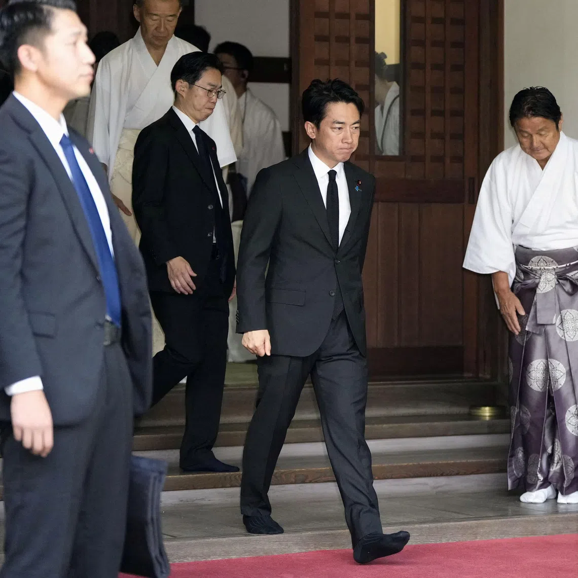 Japan's Defence Minister Shinjiro Koizumi visits at Yasukuni Shrine to pay tribute to the war dead on the 81st anniversary of Japan's surrender in World War Two, in Tokyo, Japan, August 15, 2026, in this photo taken by Kyodo Mandatory credit Kyodo/via REUTERS