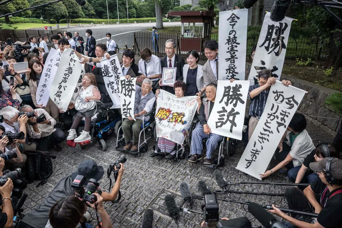 Victims of forced sterilisation celebrate after Japan’s top court ruled on July 3, 2024 that a now defunct eugenics law is unconstitutional.