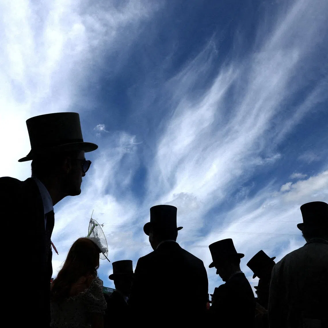 Racegoers silhouetted during the Royal Ascot 2026 horse racing festival, held at the Ascot Racecourse, Britain, on June 16, 2026.
