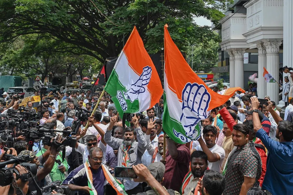 Supporters of the opposition Congress party in India celebrate their victory in the crucial state of Karnataka. 