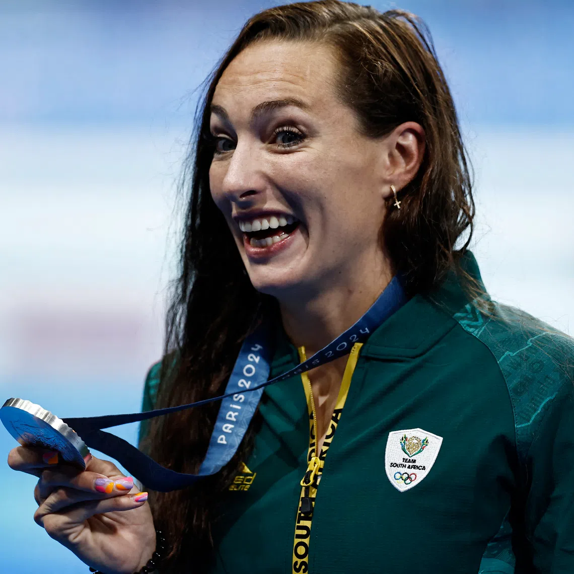 FILE PHOTO: Paris 2024 Olympics - Swimming - Women's 200m Breaststroke Victory Ceremony - Paris La Defense Arena, Nanterre, France - August 01, 2024. Silver medallist Tatjana Smith of South Africa celebrates on the podium. REUTERS/Clodagh Kilcoyne/File Photo