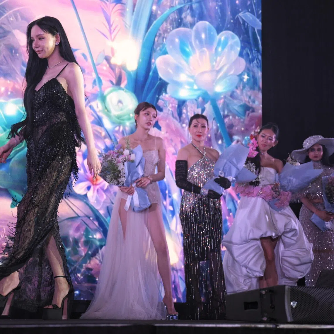 Socialite Kim Lim (left), 35, and finalists of the "20 Best Dressed" seen on stage during the annual ICON Ball by ICON Magazine held at Resorts World Convention Centre mingle on May 26, 2026.