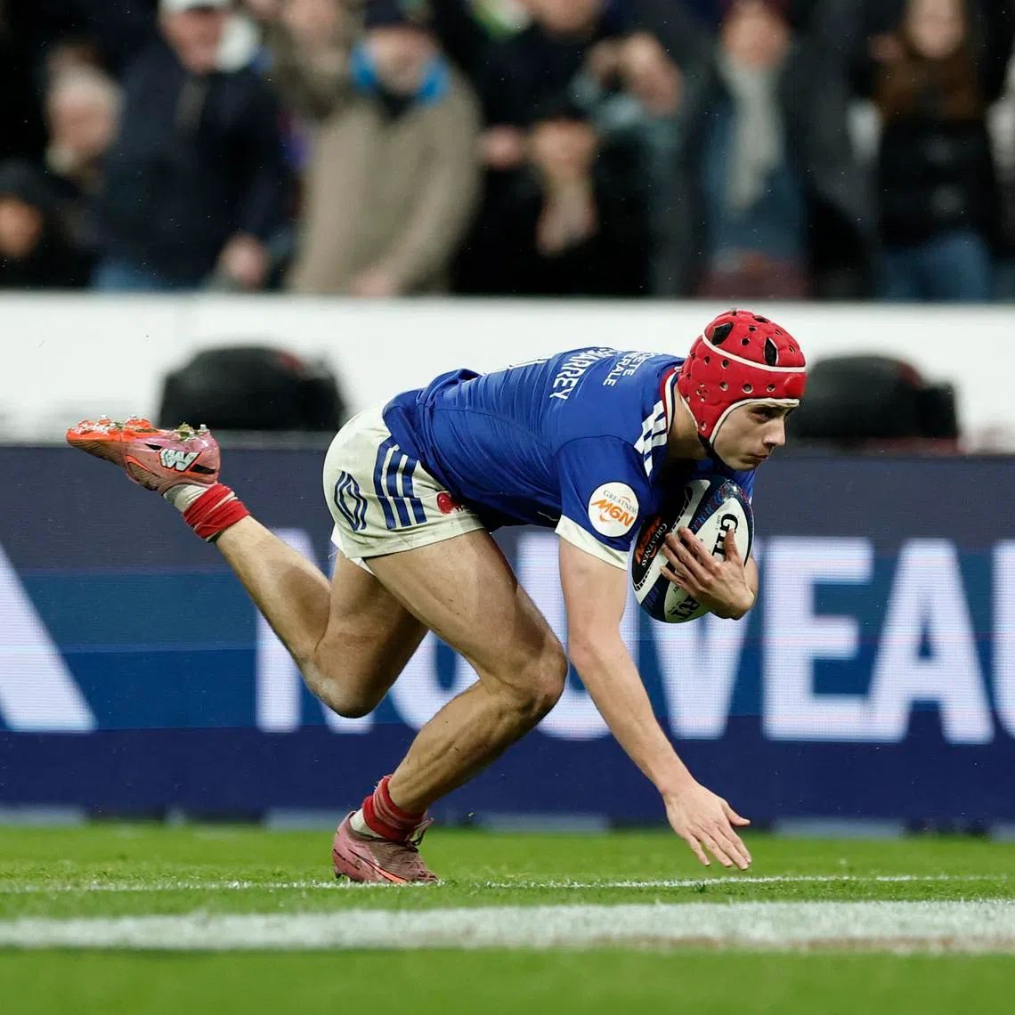 France's Louis Bielle-Biarrey scores their fourth try against Ireland on Feb 5.